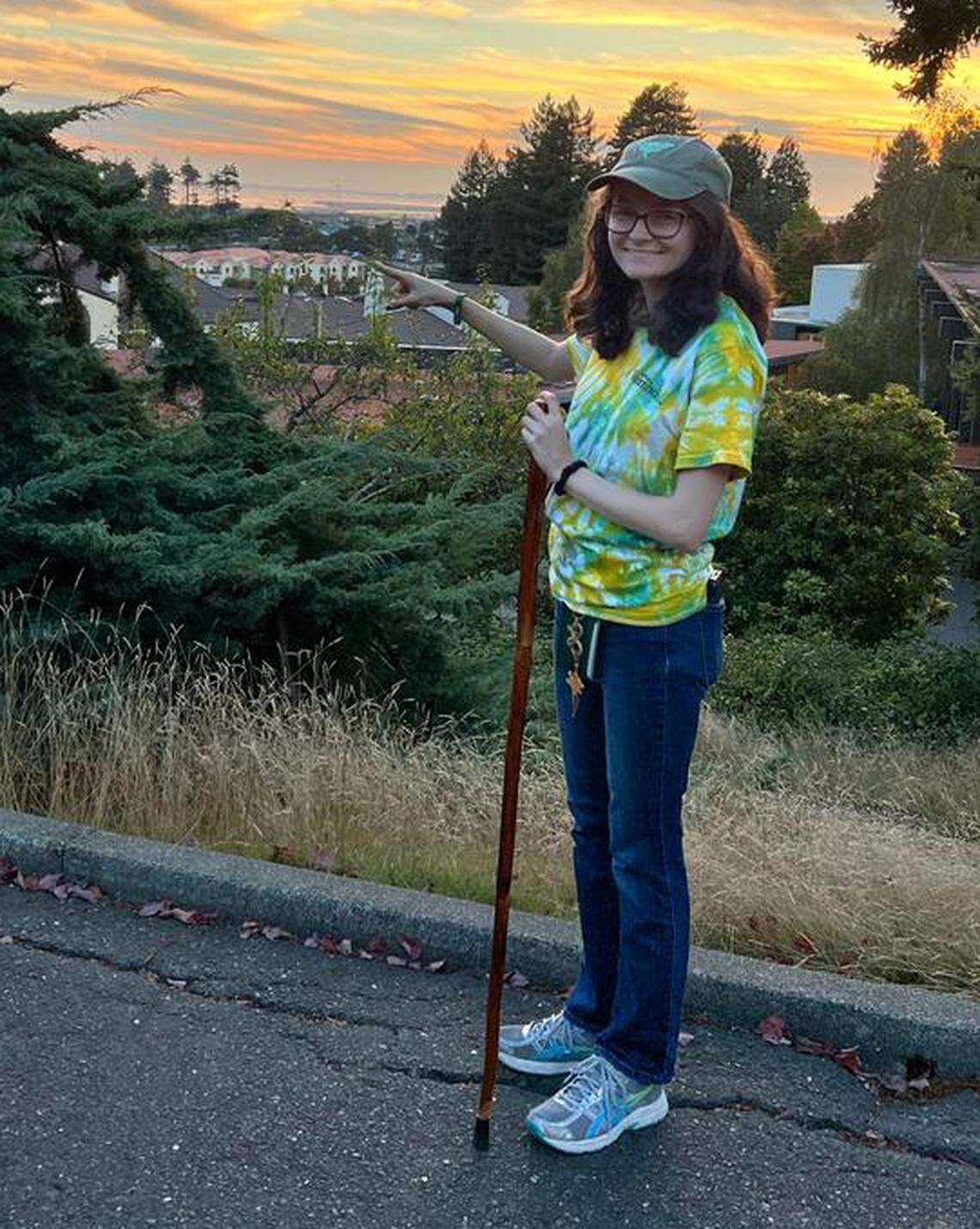 Cal Poly Humboldt student Naomi Schumichen points to her dorm. She was suspended by the university after the demonstrations on campus.