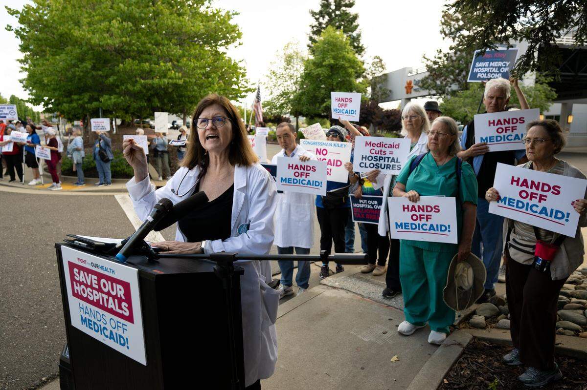 Dr. Kimberly Buss raises her concerns during a “Save Our Hospitals” rally on Tuesday at Folsom’s Dignity Health Mercy Hospital about the potential impact of Medicaid cuts on health care services.
