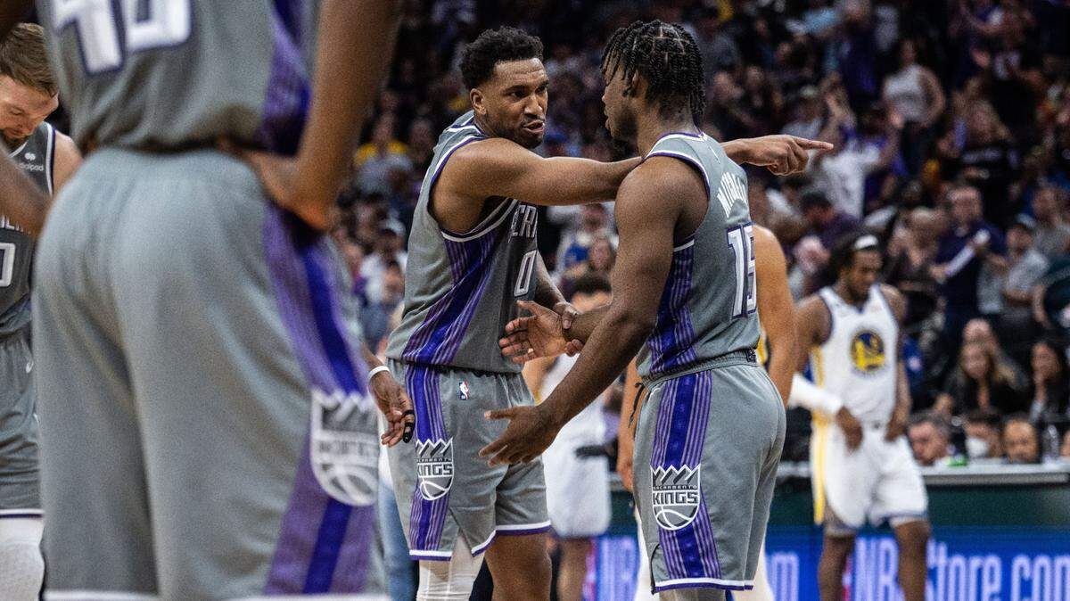 Sacramento Kings guard Malik Monk (0) points to a spot as he talks with teammate guard Davion Mitchell (15) during Game 5 of the first-round NBA playoff series at Golden 1 Center on Wednesday, April 26, 2023.