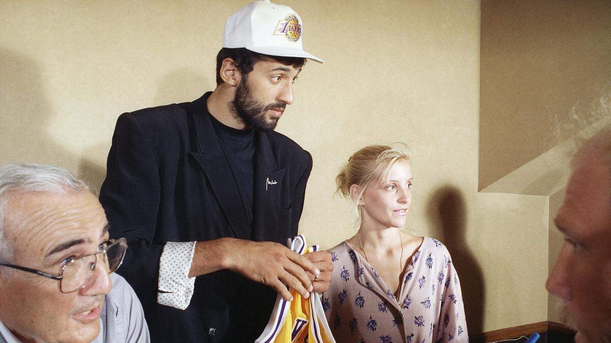 Vlade Divac, selected in the first round of the 1989 NBA draft by the Los Angeles Lakers out of Yugoslavia, attends a news conference with his wife, Snezana, on Aug. 8, 1989, in Inglewood. Divac went 25 picks after the Kings took Pervis Ellison at No. 1 overall.