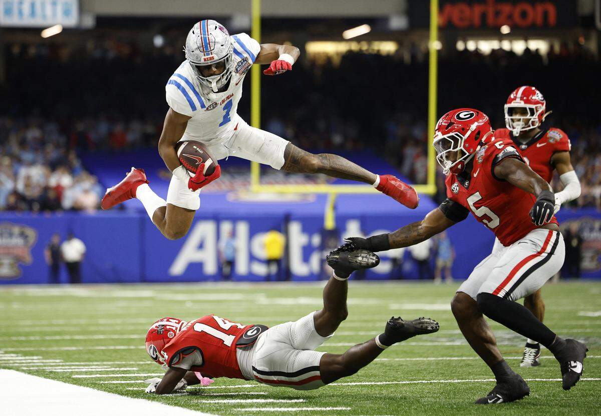 Wide receiver De'Zhaun Stribling of the Ole Miss Rebels jumps over Adrian Maddox of the Georgia Bulldogs during the fourth quarter of the 2025 College Football Playoff Quarterfinal at the Allstate Sugar Bowl at Caesars Superdome on Jan. 1 in New Orleans. 49ers quarterback Brock Purdy said Stribling could have an instant impact this season.
