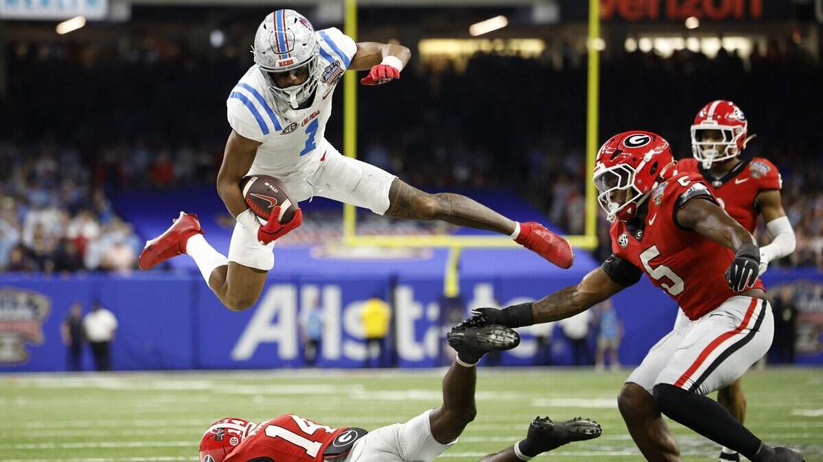 Wide receiver De’Zhaun Stribling of the Ole Miss Rebels jumps over Adrian Maddox of the Georgia Bulldogs during the fourth quarter of the 2025 College Football Playoff Quarterfinal at the Allstate Sugar Bowl at Caesars Superdome on Jan. 1 in New Orleans. The San Francisco 49ers on Friday drafted Stribling with the 33rd overall pick of the NFL draft.