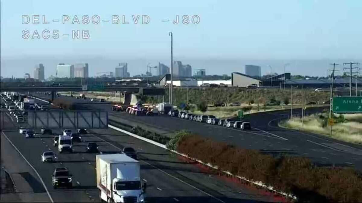 Sacramento County sheriff’s vehicles line southbound Interstate 5 just past the Arena Boulevard offramp in the North Natomas section of Sacramento on Tuesday, April 14, 2026, following an early-morning officer-involved shooting.