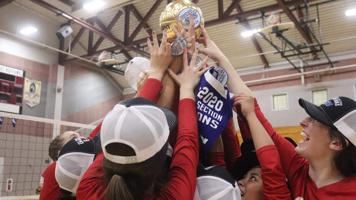 St. Francis volleyball players celebrate after winning the Sac-Joaquin Section Division I championship Saturday.
