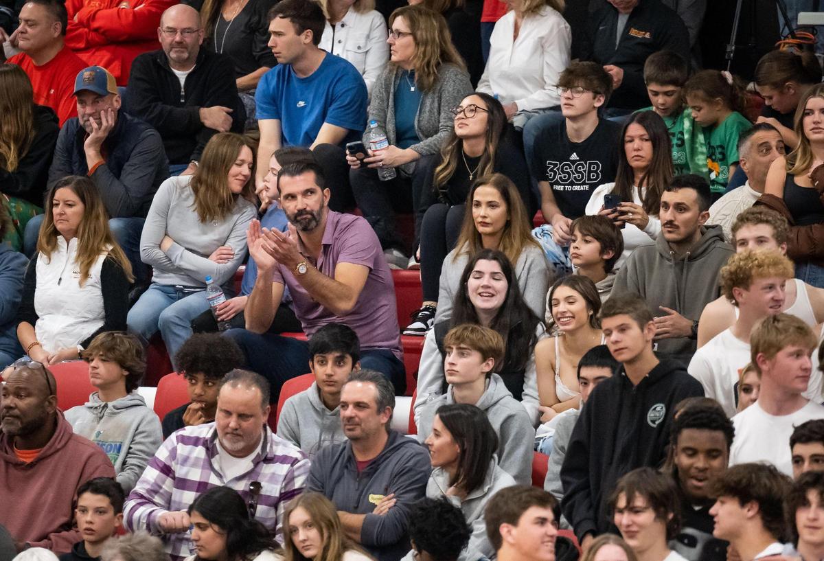Former NBA all-star and Sacramento Kings forward Peja Stojakovic applauds while watching his son, Jesuit guard/forward Andrej Stojakovic (2), and teammates play Rio Americano during the third quarter of the high school boys basketball game Friday, Dec. 16, 2022, at Jesuit High School in Carmichael.