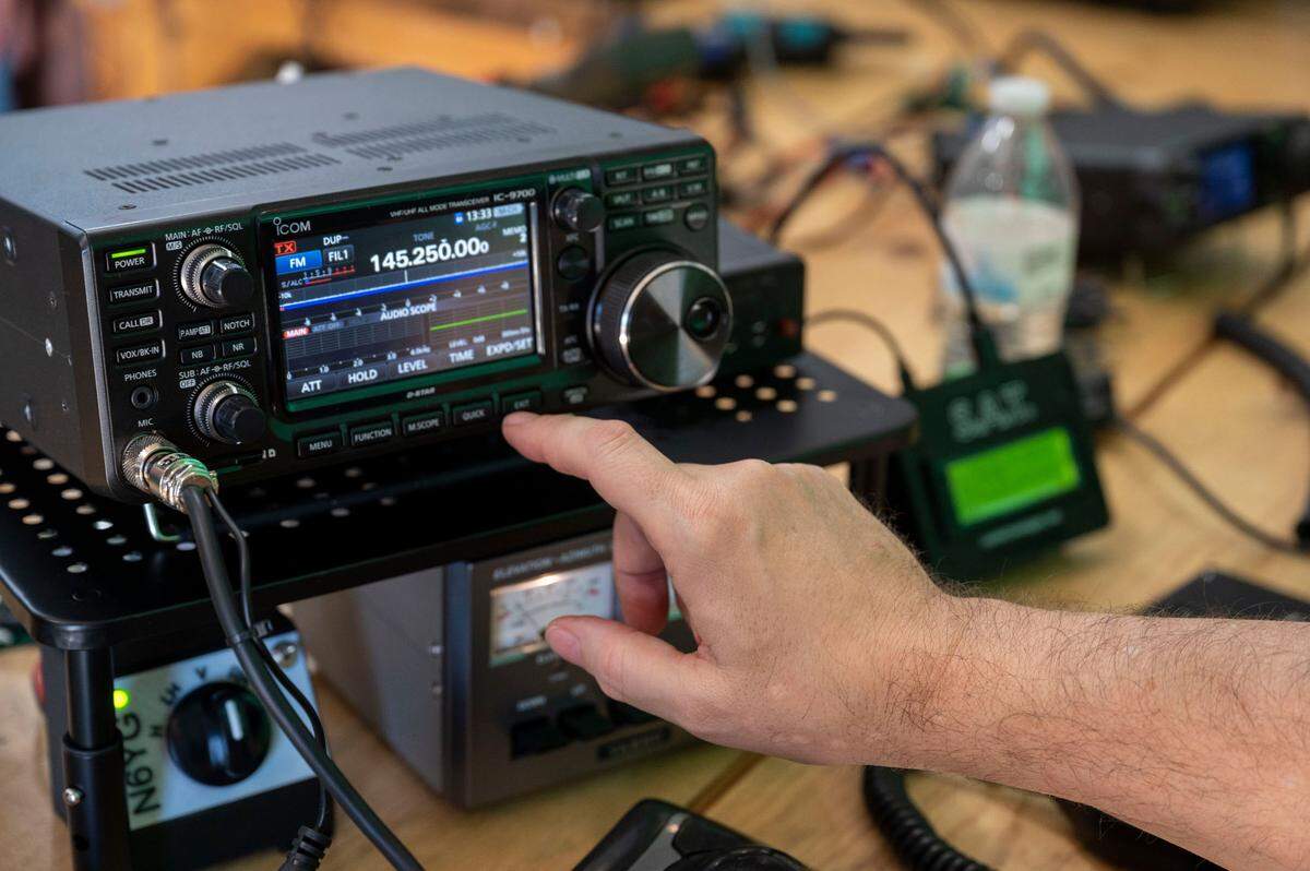 George Poulos with the River City Amateur Radio Communications Society tracks a satellite Saturday while testing out the ham radio built with a team of Girl Scouts in East Sacramento to talk with ISS astronauts next week.
