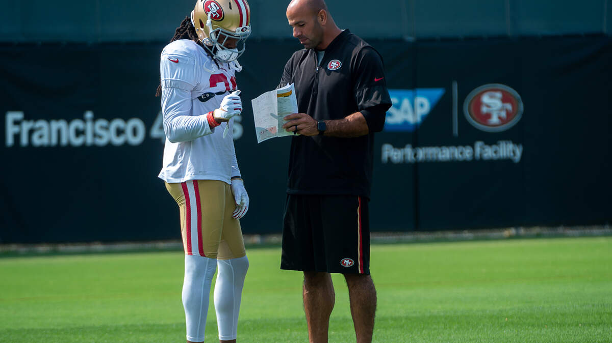 San Francisco 49ers cornerback Richard Sherman (25) talk with defensive coordinator Robert Saleh during training camp at Levi’s Stadium on Tuesday, Aug. 25, 2020 in Santa Clara.