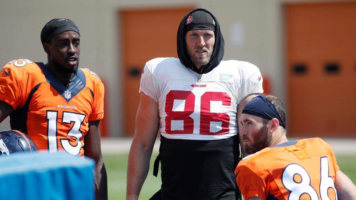 Denver Broncos receivers Steven Dunbar, left, and Nick Williams chat with 49ers long snapper Kyle Nelson during a combined practice Friday in Englewood, Colo. The teams will play a preseason game Monday in Denver.