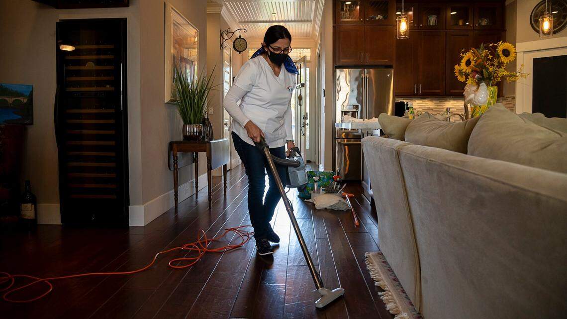 Fabiola Perez, owner of the company Top Klean Services Inc., cleans a clients home on Thursday, Nov 12, 2020 in Folsom. She said she lost 85% of her clients at the beginning of the coronavirus pandemic, but has recovered much of her business since.