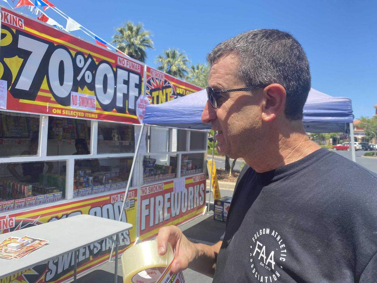 Michael Raffetto on Saturday June 28, 2025, sets up a fireworks sales booth to benefit the Folsom Athletic Association at the Bel Air shopping center on East Bidwell Street in Folsom.