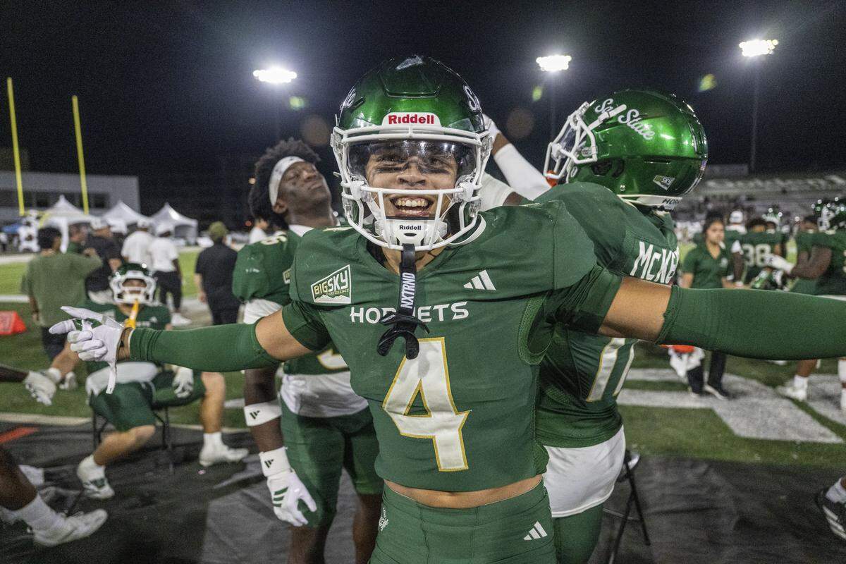 Sacramento State Hornets safety Diesel Gordon (4) celebrates an interception with teammates during an NCAA football game against Mercyhurst Lakers on Saturday, Sept. 13, 2025 at Hornet Stadium in Sacramento. The Mid-American Conference has voted to add Sacramento State as a football-only member, with the university expected to pay about $23 million in fees to transition from the FCS to the FBS level.