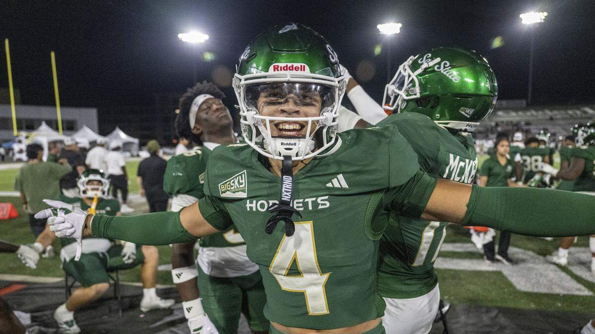 Sacramento State Hornets safety Diesel Gordon (4) celebrates an interception with teammates during an NCAA football game against the Mercyhurst Lakers on Saturday at Hornet Stadium in Sacramento.