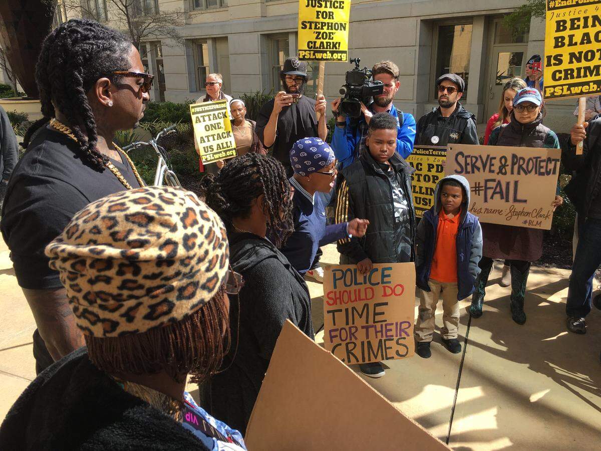 Community members protest the fatal police shooting of Stephon Clark outside Sacramento City Hall on Thursday, March 22.