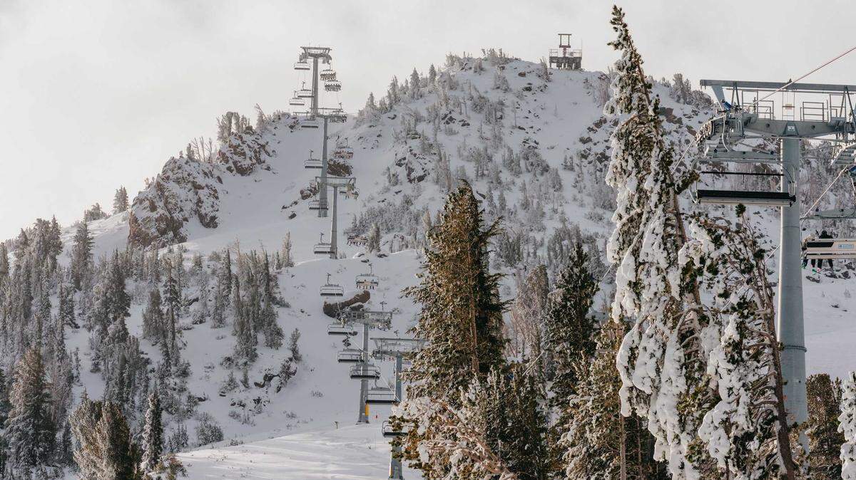 Lifts carry skiers and snowboarders up Mammoth Mountain on opening day Nov. 20 in Mammoth Lakes. Rising temperatures are reducing Sierra Nevada snowpack and delaying accumulation, scientists say.