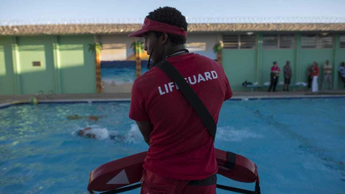 A lifeguard watches swimmers in Rosemont in 2015. Facing a staff shortage, Sacramento-area pools have embarked on a new push to recruit student lifeguards.