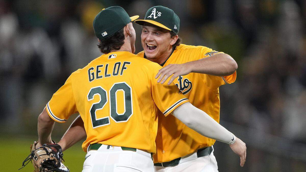 Zack Gelof and Nick Kurtz of the Athletics celebrate defeating the New York Yankees, 6-4, at Sutter Health Park on Saturday in West Sacramento.