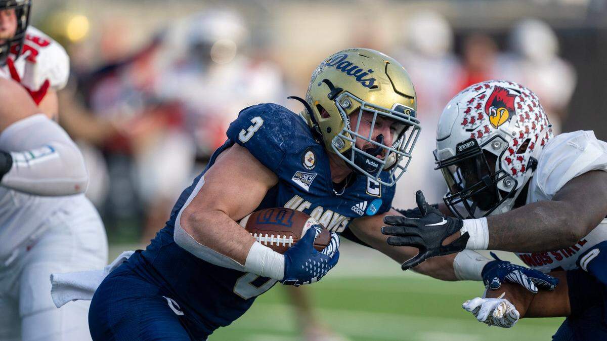 UC Davis Aggies running back Lan Larison, seen running vs. the Illinois State Redbirds on Dec. 7 at UC Davis Health Stadium in Davis, missed the final three quarters of Saturday’s FCS quarterfinal road game vs. South Dakota, which the Aggies lost 35-21 at the DakotaDome.