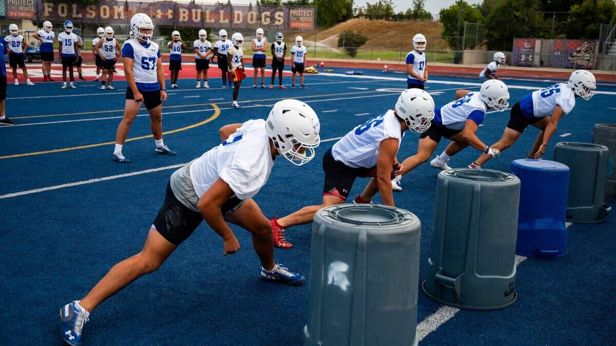 Folsom football players run a blocking drill on Monday, July 26, 2021, during the kickoff practice for a fall season that started only a few months after the end of the COVID-delayed 2020-21 campaign. Folsom’s last game was April 16.