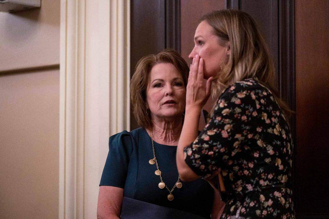 Sen. Shannon Grove, R-Bakersfield, center, talks with Lindsey Dietz, a member of her staff while waiting for the Assembly Public Safety Committee hearing vote July 13, 2023, to advance her child sex trafficking bill. The bill was signed into law by Gov. Gavin Newsom last month.