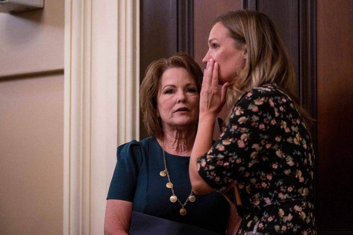Sen. Shannon Grove, R-Bakersfield, center, talks with a member of her staff, Lindsey Dietz, right, while waiting for the Assembly Public Safety Committee hearing vote Thursday to advance her child sex trafficking bill.