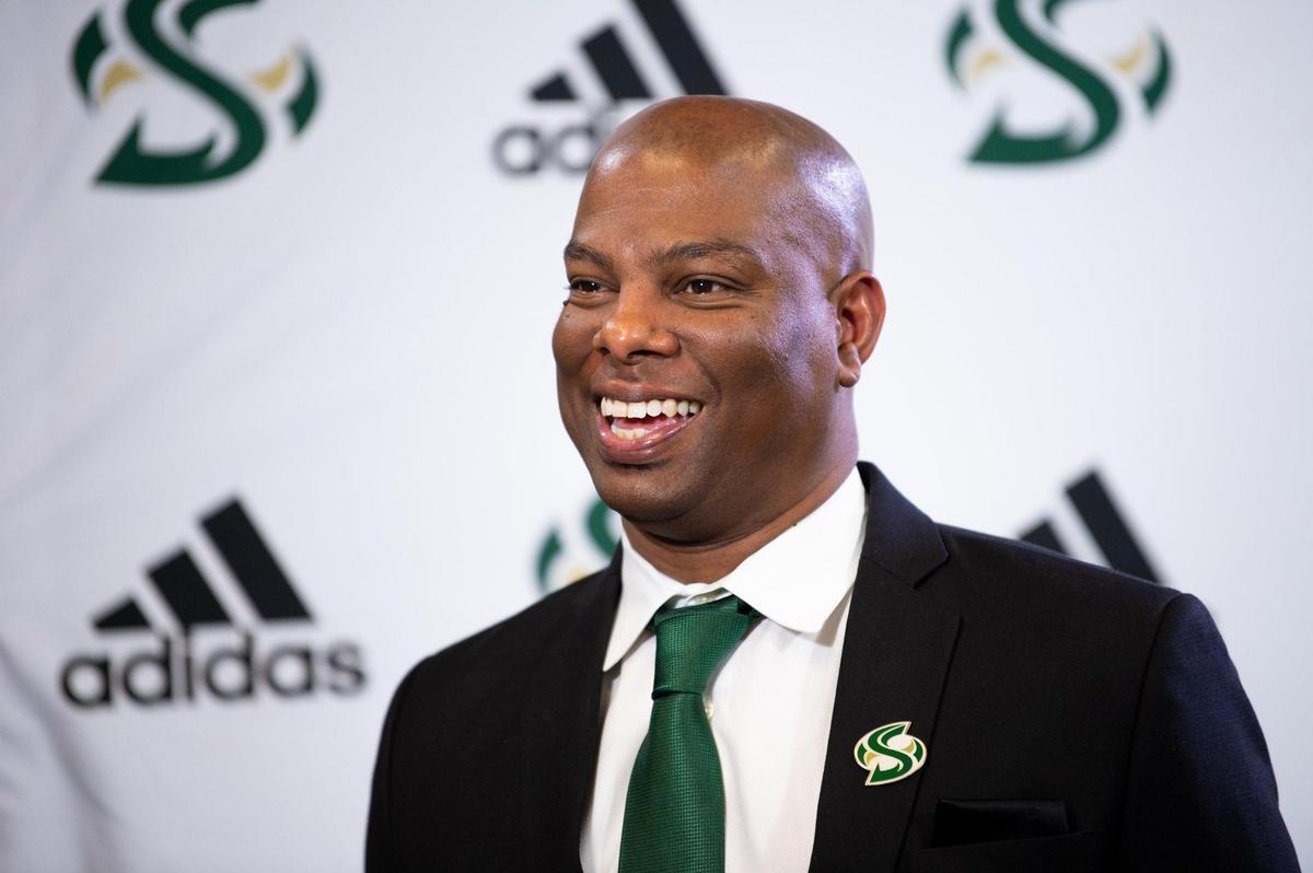 Sacramento State new men’s basketball coach David Patrick is introduced during a news conference with athletic director Mark Orr at California State University in Sacramento on Tuesday.