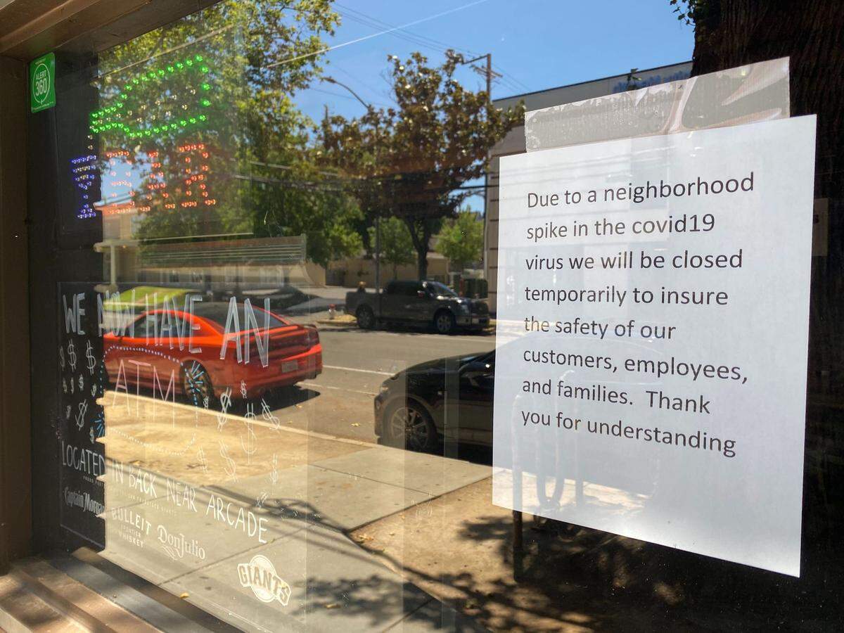 A sign on the doors of Old Tavern Bar and Grill in Sacramento on June 27, 2020, announces the closure of the establishment as coronavirus infections pop up around midtown.