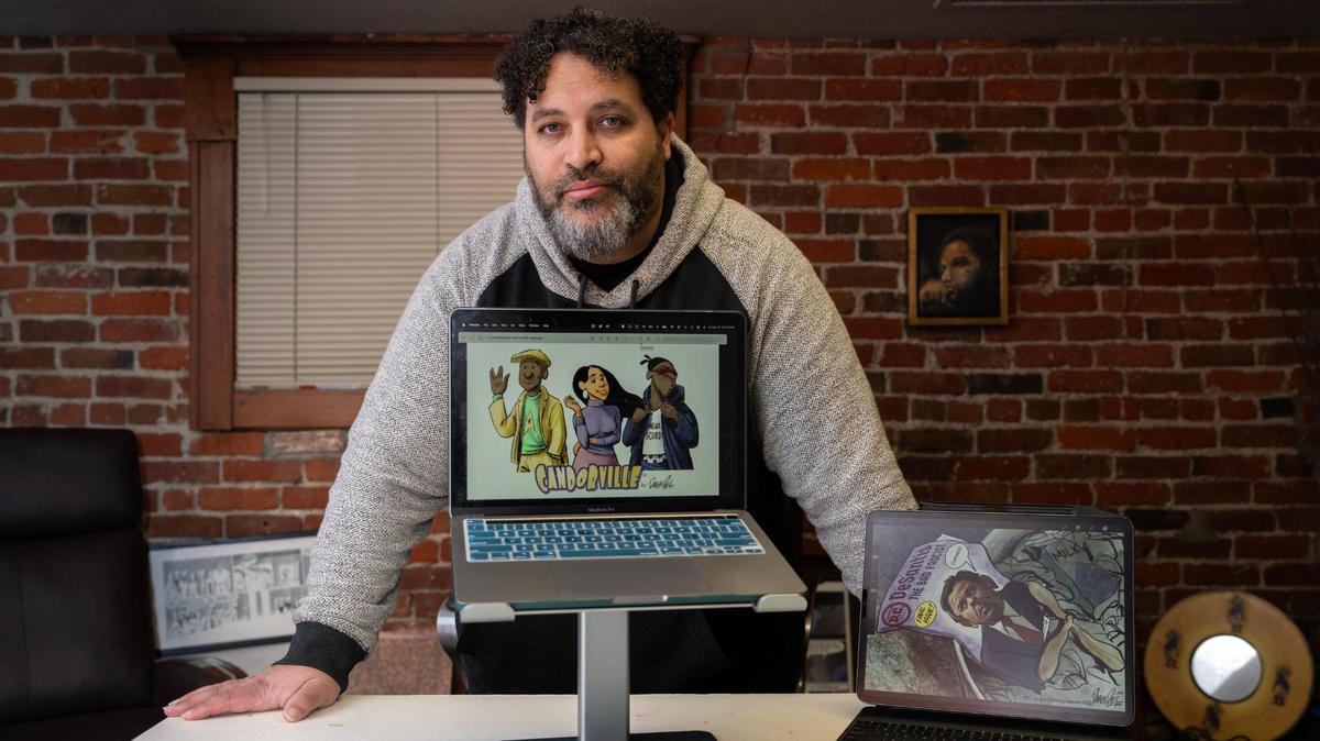 Pulitzer Prize-winning cartoonist Darrin Bell, creator of the syndicated comic strip Candorville about three childhood friends – a blogger and single father, a rapper and a wealthy Latina advertising executive – is photographed in his Sacramento office on Friday, Feb. 16, 2024. Bell will be discussing his graphic novel, “The Talk” during the Black History Month Festival at the Crocker Museum.