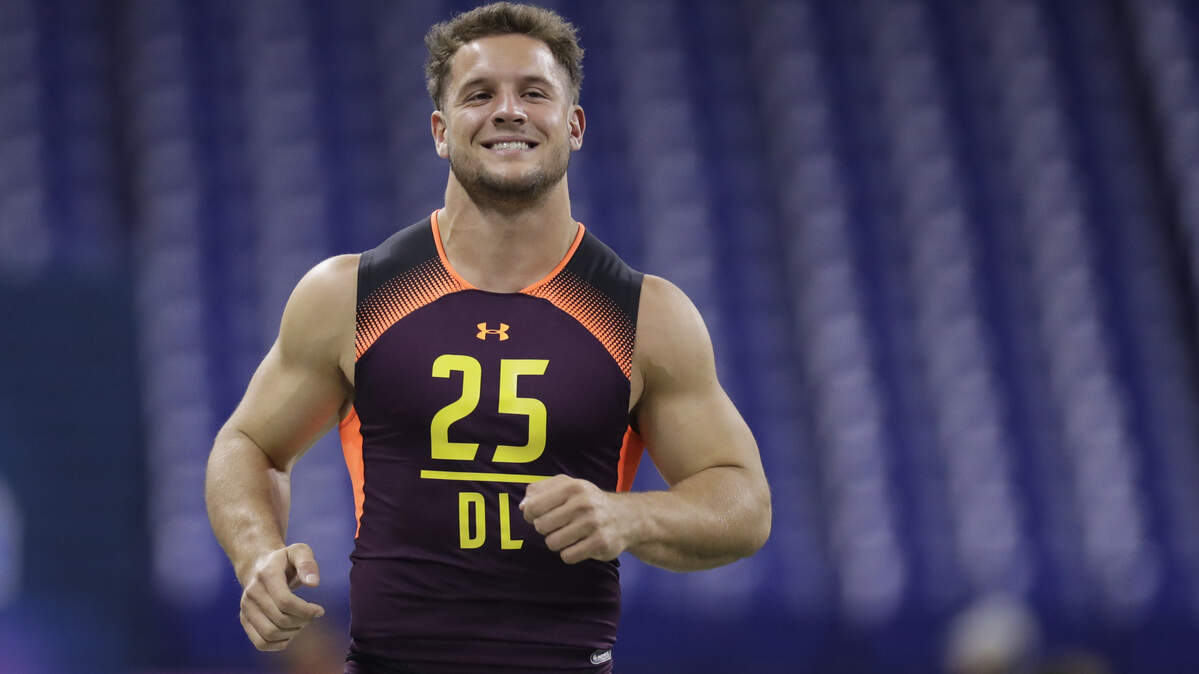 Defensive lineman Nick Bosa smiles after running the 40-yard dash during the NFL football scouting combine, Sunday, March 3, 2019, in Indianapolis.