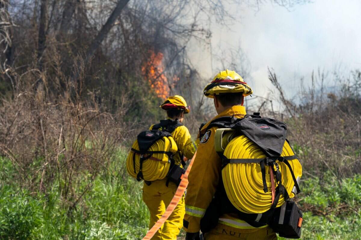 Firefighters from the Sacramento Fire Department respond to a two-alarm fire near Discovery Park on Friday.