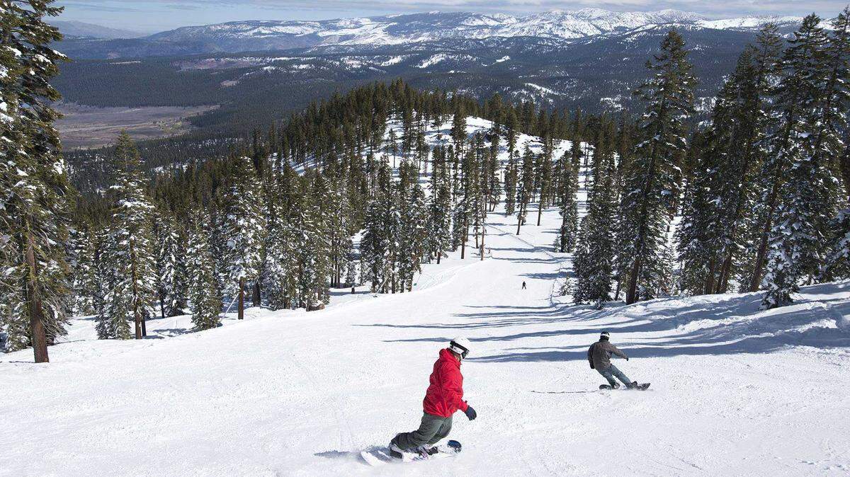 Snowboarders head down a run at Northstar ski resort in 2016. A 26-year-old Los Angeles man died in a skiing accident on Martis Trail at the resort on Feb. 6, 2026, according to the Placer County Sheriff’s Office.