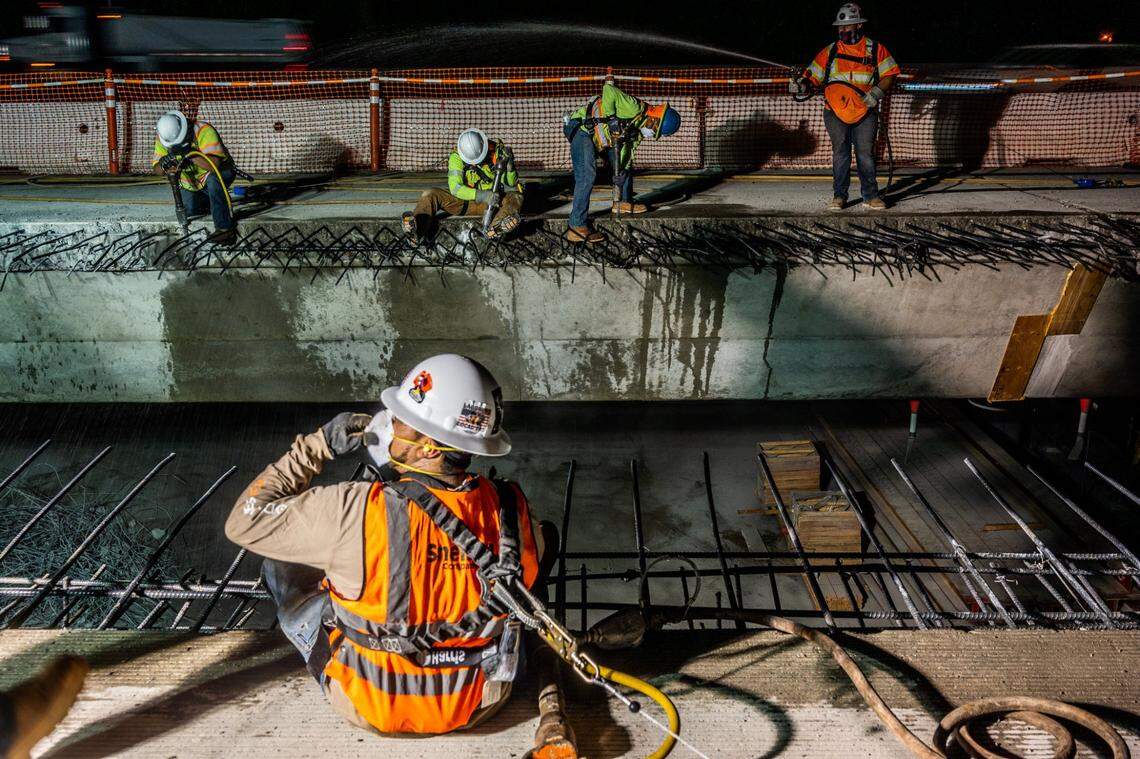 Construction workers demo the overhang and the barrier rail on the W-X freeway in Sacramento on Thursday, May 20, 2021. This is the largest construction project in CalTrans Sacramento history. The project is expected to be completed by late 2024 or early 2025.