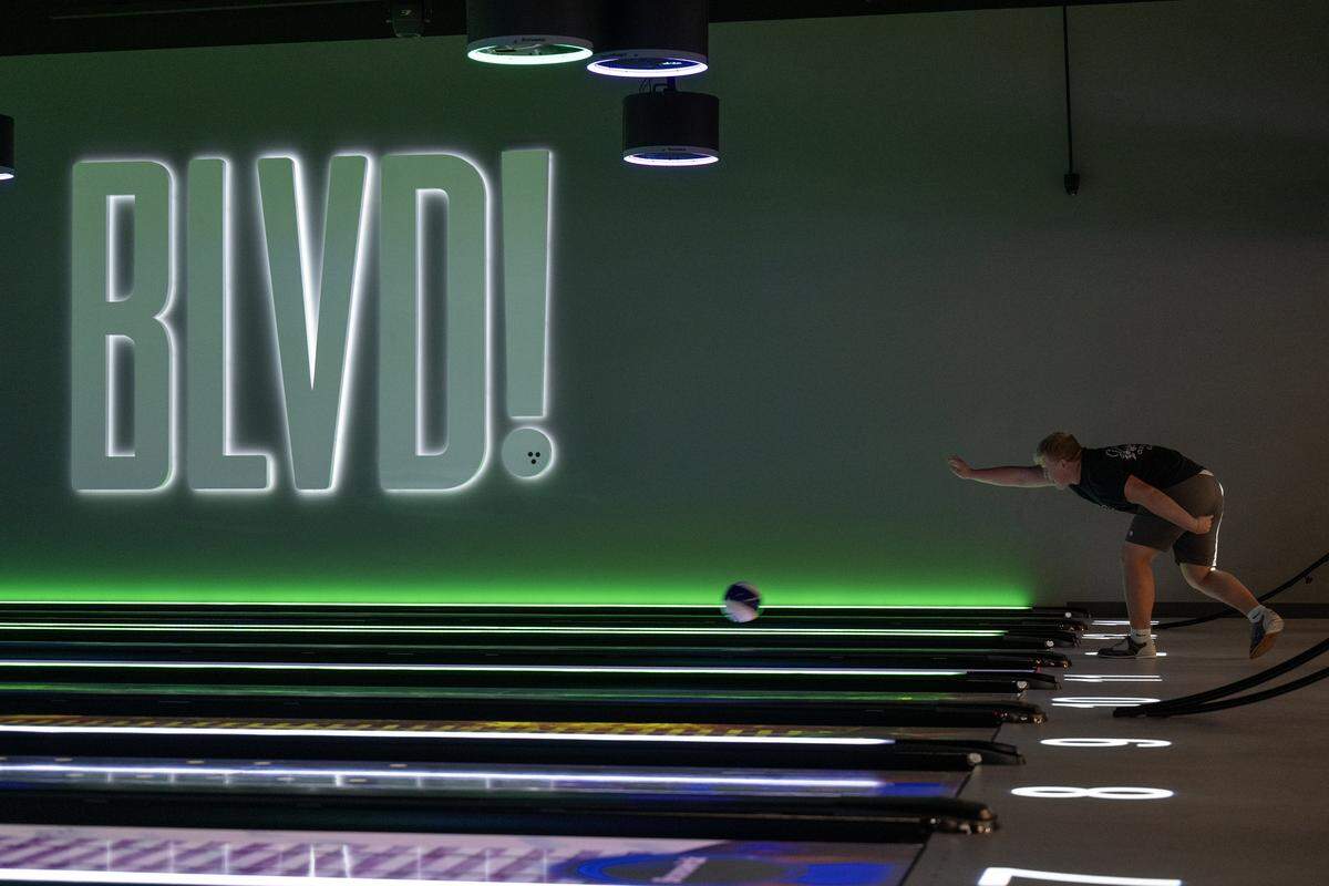 A man bowls at the BLVD, a 37,000 sq. ft. indoor space with an elevated mix of attractions including 20 lanes of state-of-the-art immersive bowling, in West Sacramento on Wednesday, Aug. 6, 2025.