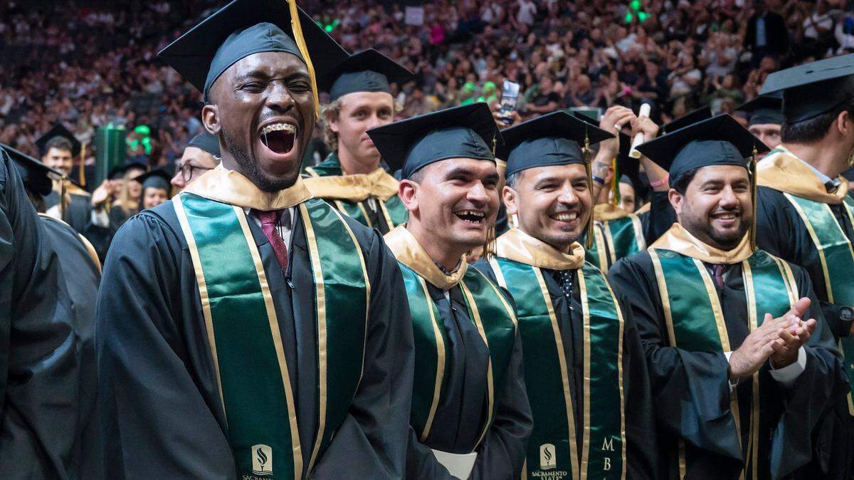 Graduates cheer during the Sacramento State College of Business commencement at Golden 1 Center in 2023. California has an opportunity to improve access to higher education for non-traditional learners.