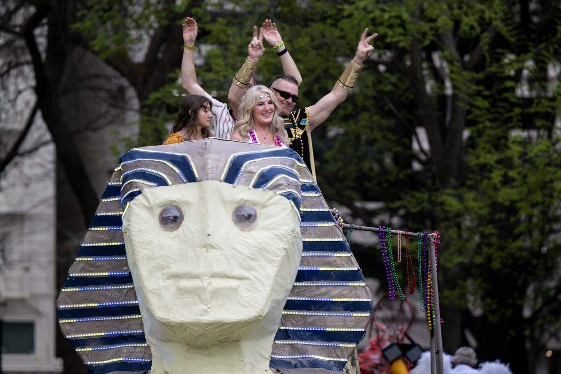 Sphinx riders wave to the crowds of people on Capitol Mall during the City of Trees Parade on Saturday, Feb. 28, 2026.