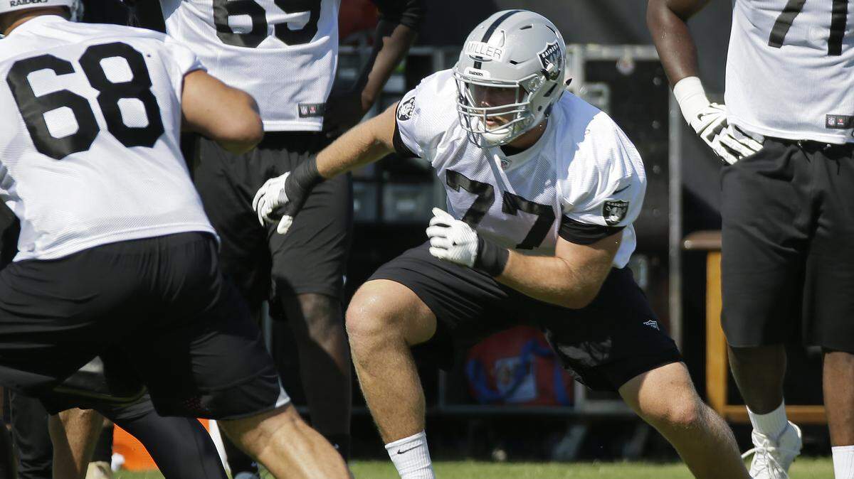 Raiders offensive tackle Kolton Miller (77) takes part in a drill during training camp July 27 in Napa.