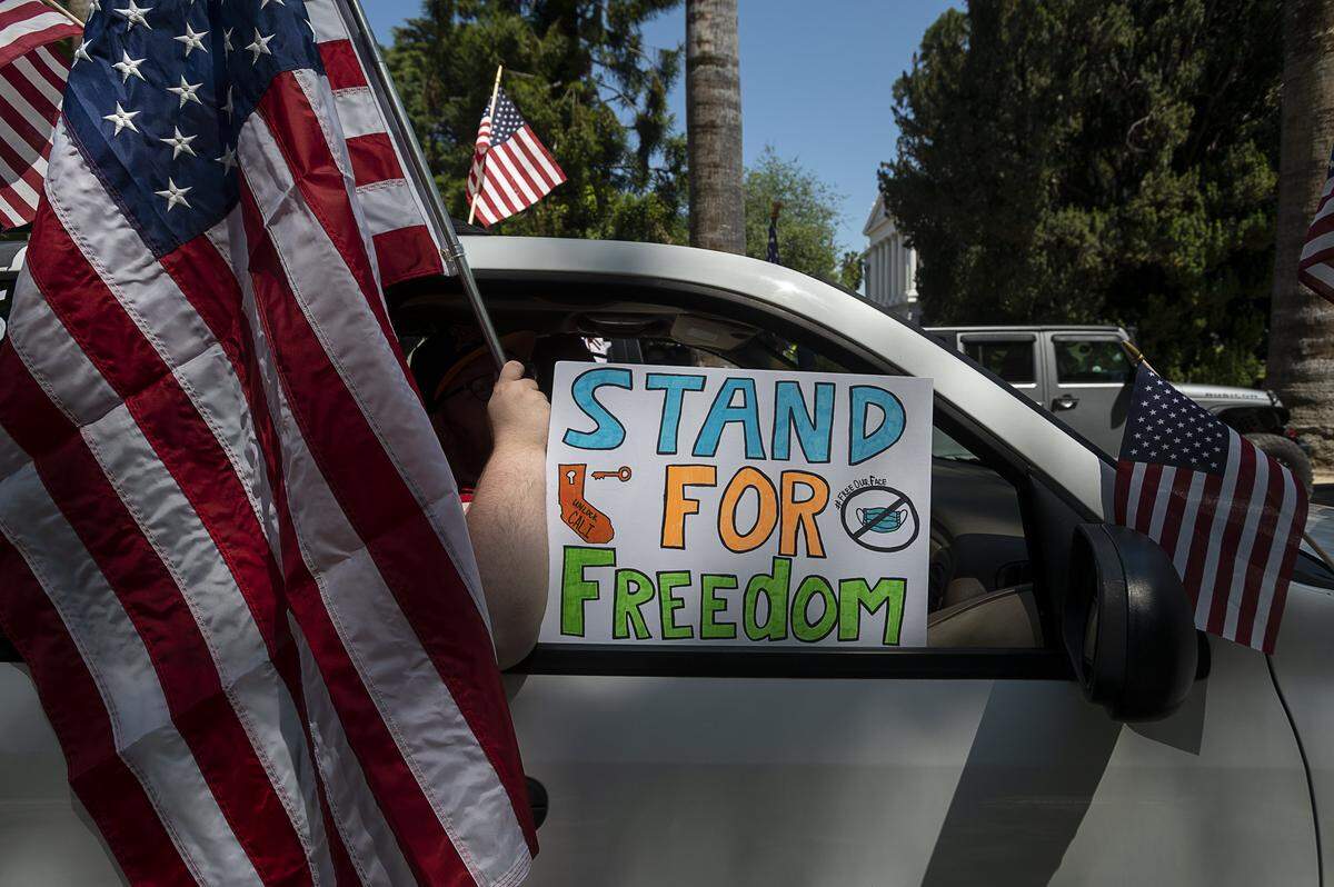 Tim Cook of Vallejo demonstrates at the Capitol in Sacramento on Friday, May 1, 2020, against Gov. Gavin Newsom’s stay-at-home order to slow the spread of the coronavirus.
