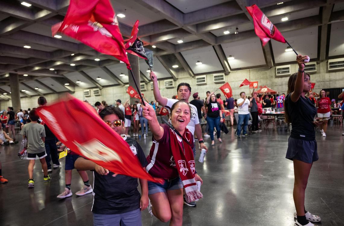 Fans wave flags at the watch party at SAFE Credit Union Convention Center as Sacramento Republic FC plays Orlando City SC at the U.S. Open Cup final Wednesday, Sept. 7, 2022, at Exploria Stadium in Orlando.
