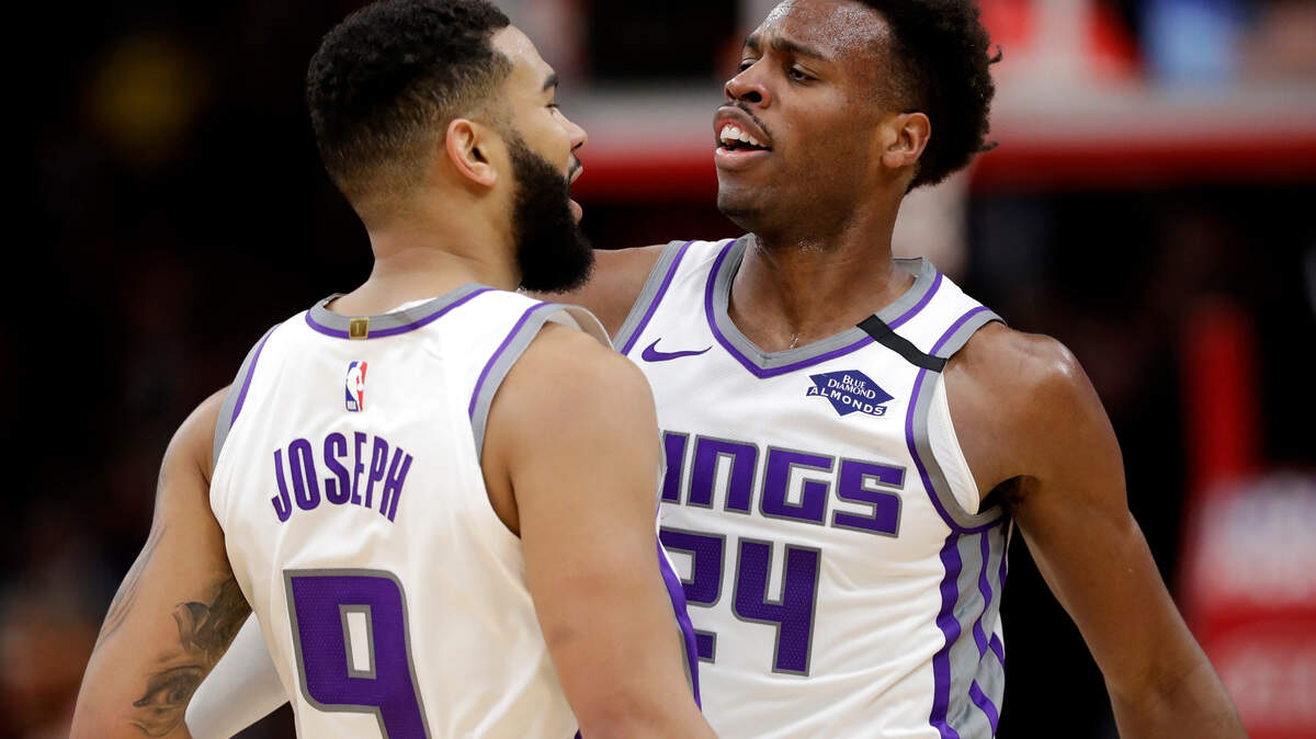 Sacramento Kings guard Cory Joseph, left, celebrates with guard Buddy Hield after scoring basket during the second half of an NBA basketball game against the Chicago Bulls in Chicago, Friday, Jan. 24, 2020. The Kings won 98-81.(AP Photo/Nam Y. Huh)
