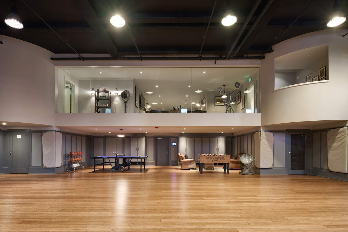 Amenities include a full-size basketball court, hot tub, spa and wellness level, golf simulator, wine lounge, bar and rooftop retreat and garage space capable of storing up to 20 cars.