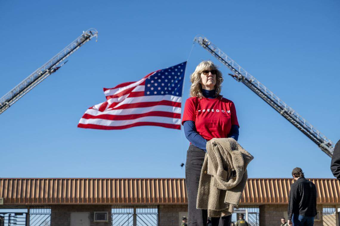 Deedi Christian of Chico watches from the overflow seating area during the memorial service for Rep. Doug LaMalfa at the Silver Dollar Fairgrounds in Chico on Saturday.