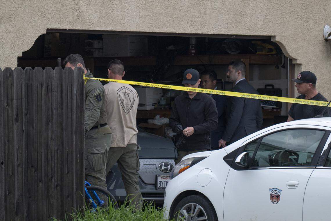 Law enforcement officers investigate a crime scene at a home on Mill Water Circle in Rancho Cordova where four people were found shot to death on Tuesday, Jan. 27, 2026.