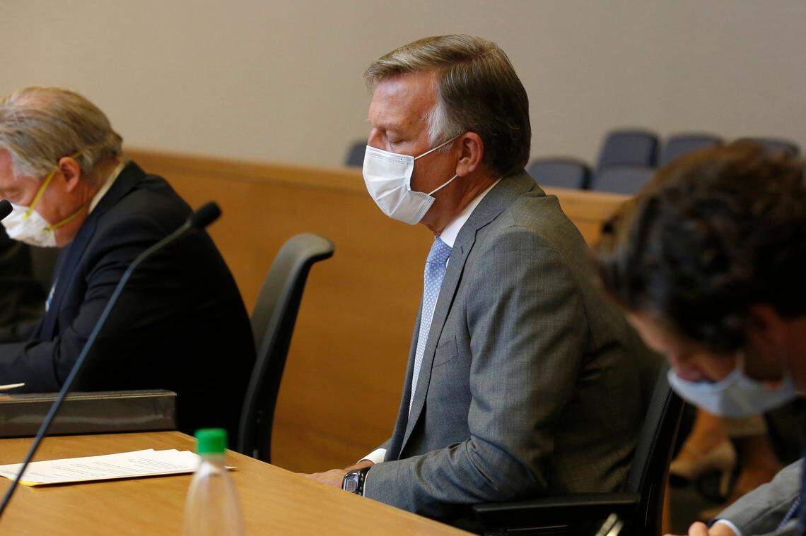 Bill Smith, interim chief executive officer and president of PG&E Corp., listens as Butte County Superior Court Judge Michael Deems announces the penalties for its role in the 2018 Camp Fire, during the criminal sentencing hearing in the trial of Pacific Gas & Electric Corp in Chico on Thursday, June 18, 2020. PG&E received the maximum fine of $3.5 million for its crimes and an additional $500,000 for the cost of the investigation into the cause of the wildfire. The utility company pleaded guilty, Tuesday, to 84 felony counts of involuntary manslaughter for the fire that wiped out the town of Paradise.