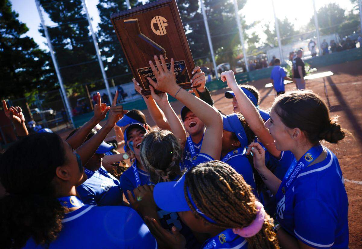 Capital Christian celebrates after defeating Willow Glen in the CIF Northern California Division I softball championship game at Willow Glen High School in San Jose on Saturday.