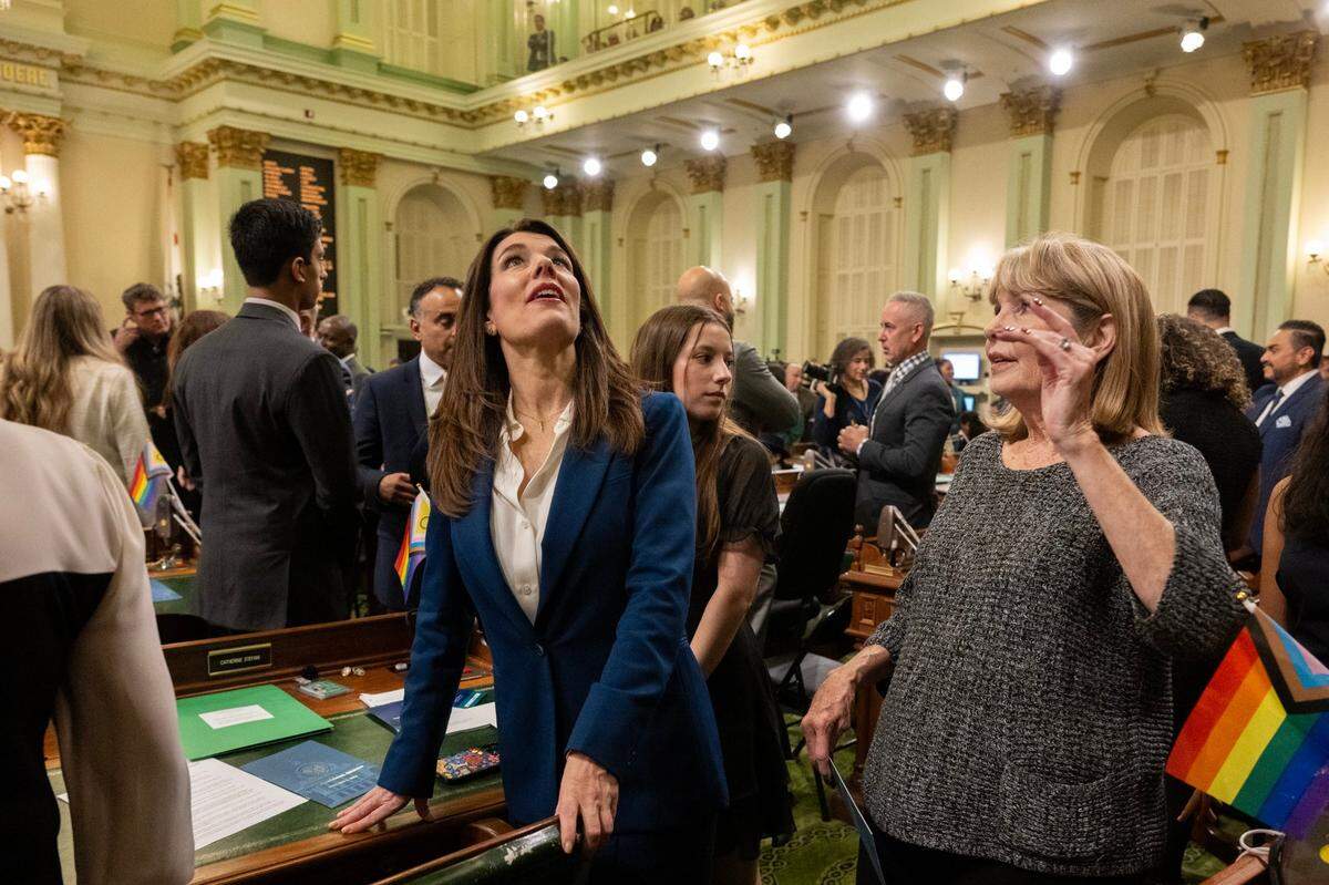 Newly elected Assemblymember Catherine Stefani, D-San Francisco, and her mother Susan Poole greet other legislators at the state Capitol during the Assembly’s first meeting of the new legislative session on Monday.