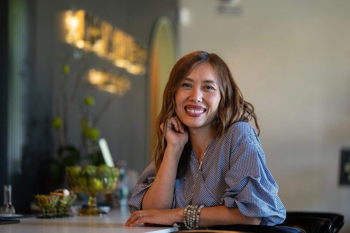 Moonshine & Nail Bar owner Lien Glankler sits in her salon and bar in Curtis Park earlier this month.