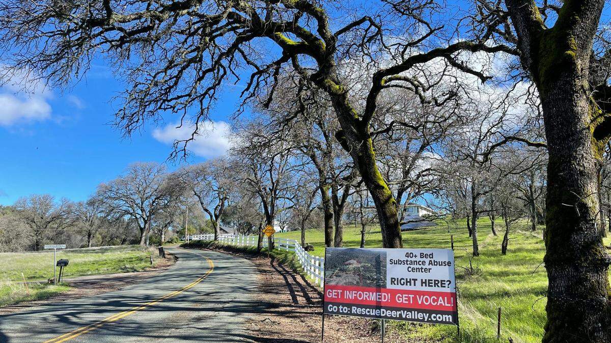 A sign for the Rescue Deer Valley group greets drivers on Deer Valley Road in El Dorado County. The group opposes two grant-funded residential facilities for vulnerable Native women.