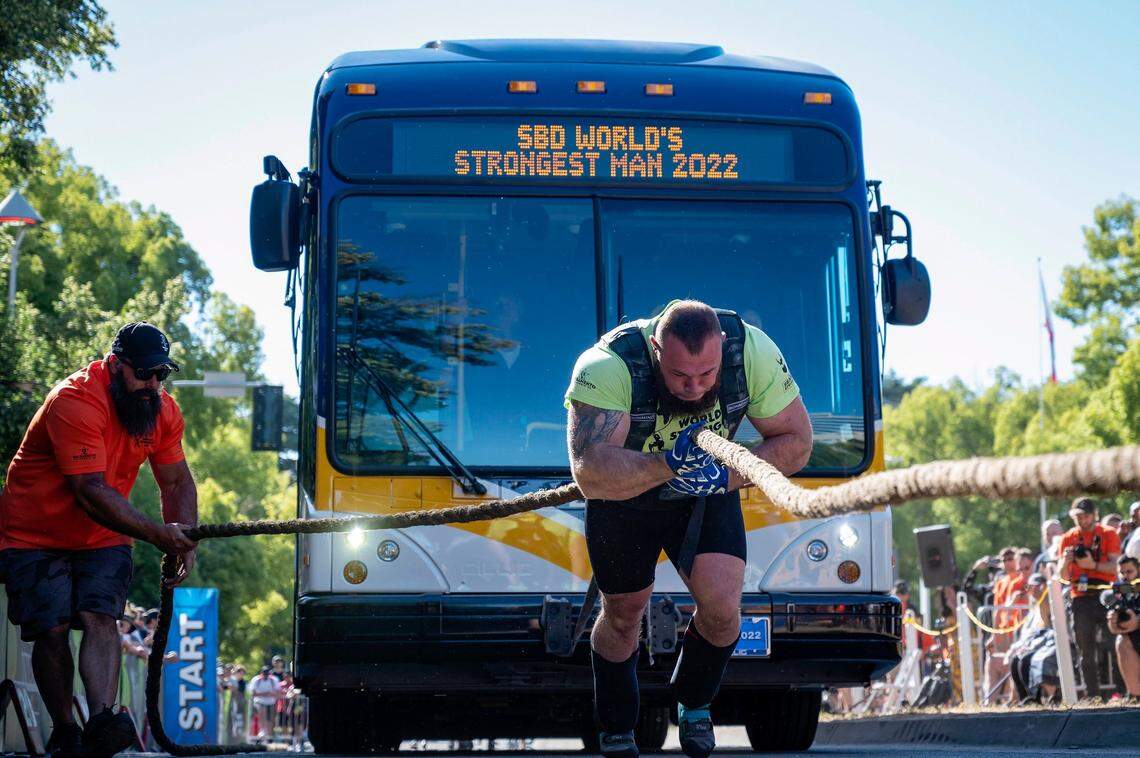 Oleksii Novikov, of Ukraine, pulls a Regional Transit bus 30 meters during the Worlds Strongest Man competition at Capitol Mall in downtown Sacramento on Sunday, May 29, 2022. Novikov finished first place out of ten athletes with a time of 0:41.51 seconds. He won the competition in 2020.