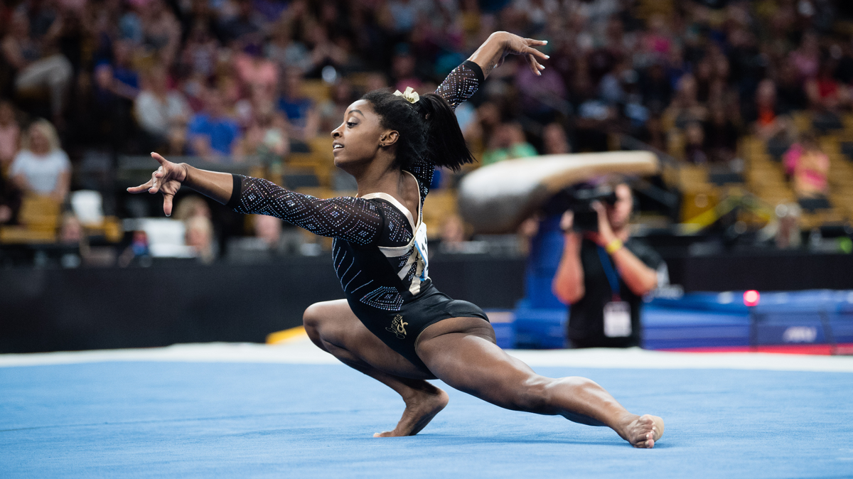 Simone Biles — who will headline the Gold Over America tour — performs a floor routine.