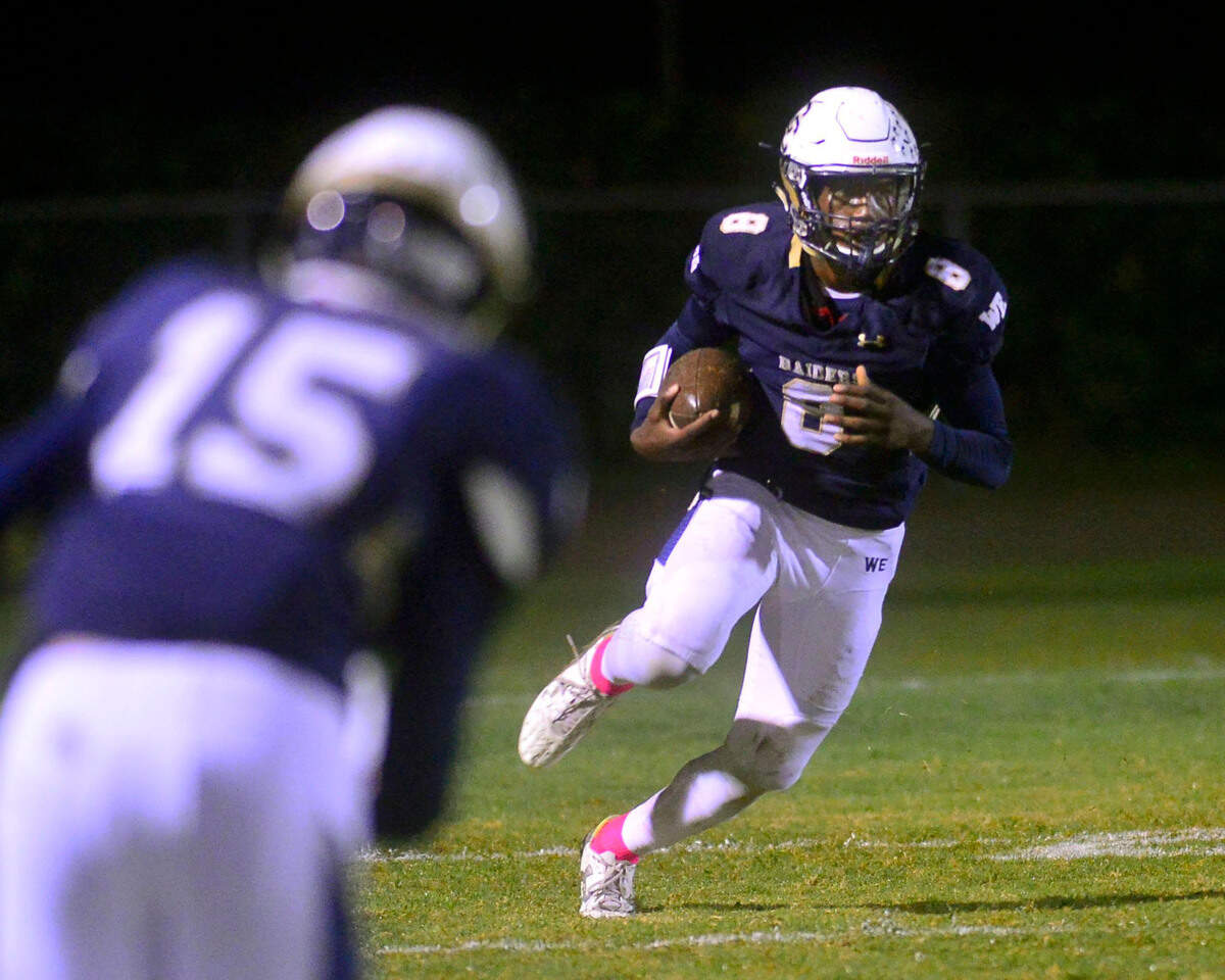 Central Catholic’s DaRon Bland (8) runs back a kick return against Manteca High School in Modesto in 2016.