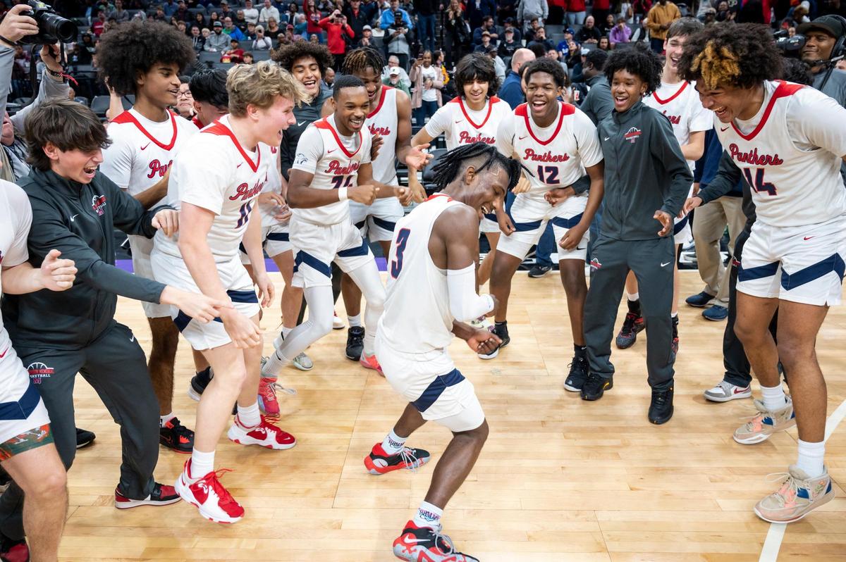 San Joaquin Memorial Panthers guard Armari Carraway (3) dances in celebration with his team after winning the CIF State Division II Boys Basketball Championship against the Pacifica Christian Tritons on Saturday, March 11, 2023, at Golden 1 Center in Sacramento. Carraway had 13 points. The Panthers defeated the Tritons 58-47.